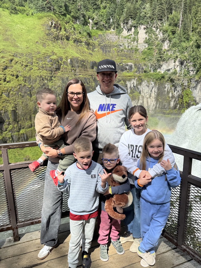 James, Brittany, and their five children together at a waterfall